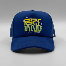 Load image into Gallery viewer, A royal blue trucker cap with a graphic text 'PORTLAND' on the front.