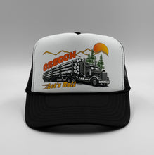 Load image into Gallery viewer, Oregon Trucker hat with logging truck and mountain design on a white and black cap
