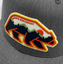 Load image into Gallery viewer, Gray and white Pacific Northwest cap with colorful bear design on a gray background
