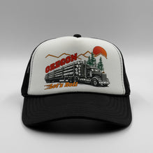 Load image into Gallery viewer, Oregon Trucker hat with logging truck and mountain design on a white and black cap
